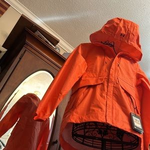 Under Armour NWT Orange Rain Jacket, full zip, with hood.  Women’s Small